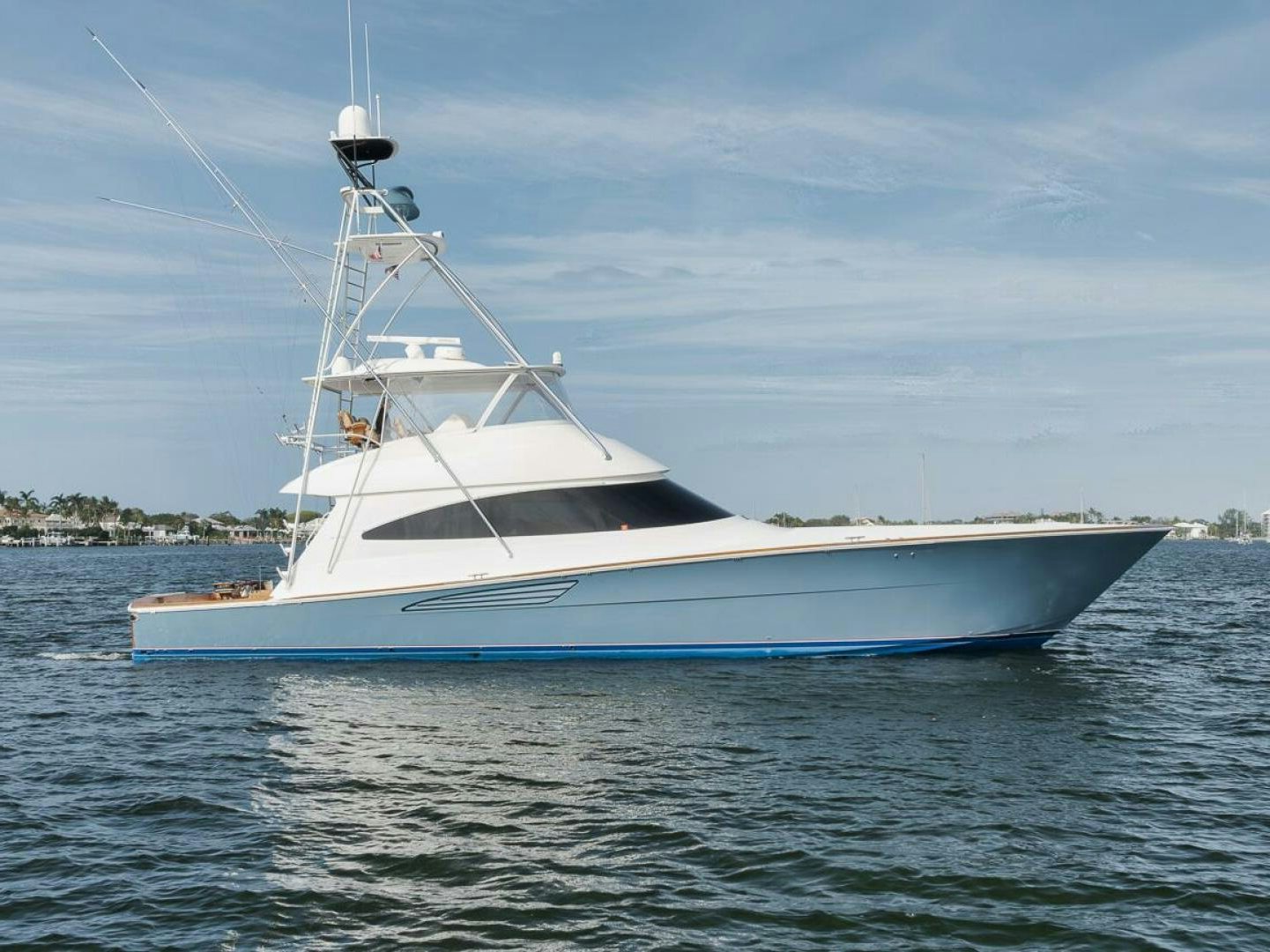 a white boat on the water aboard JO-LI Yacht for Sale
