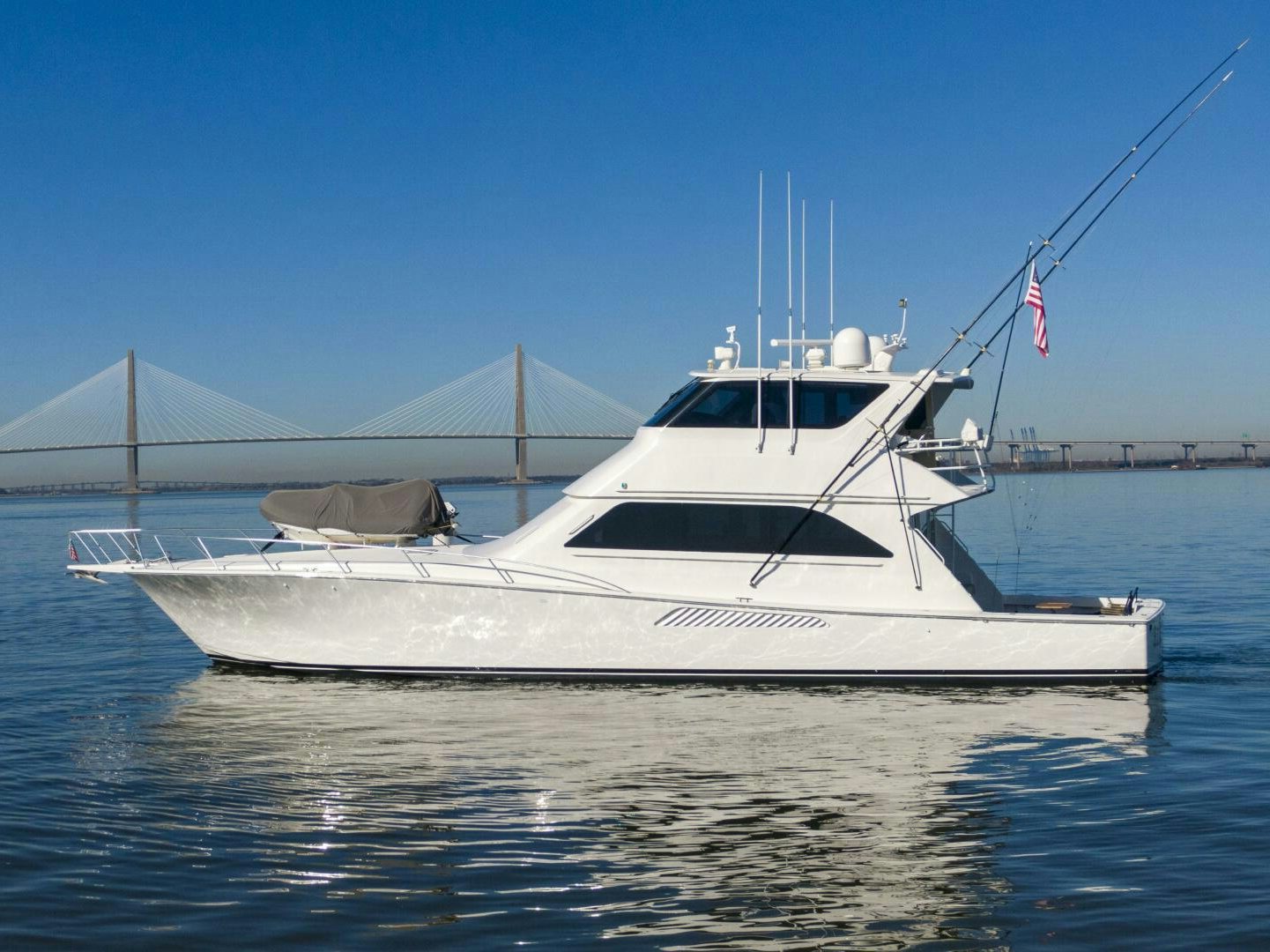 a white boat on the water aboard PRIME TIME Yacht for Sale