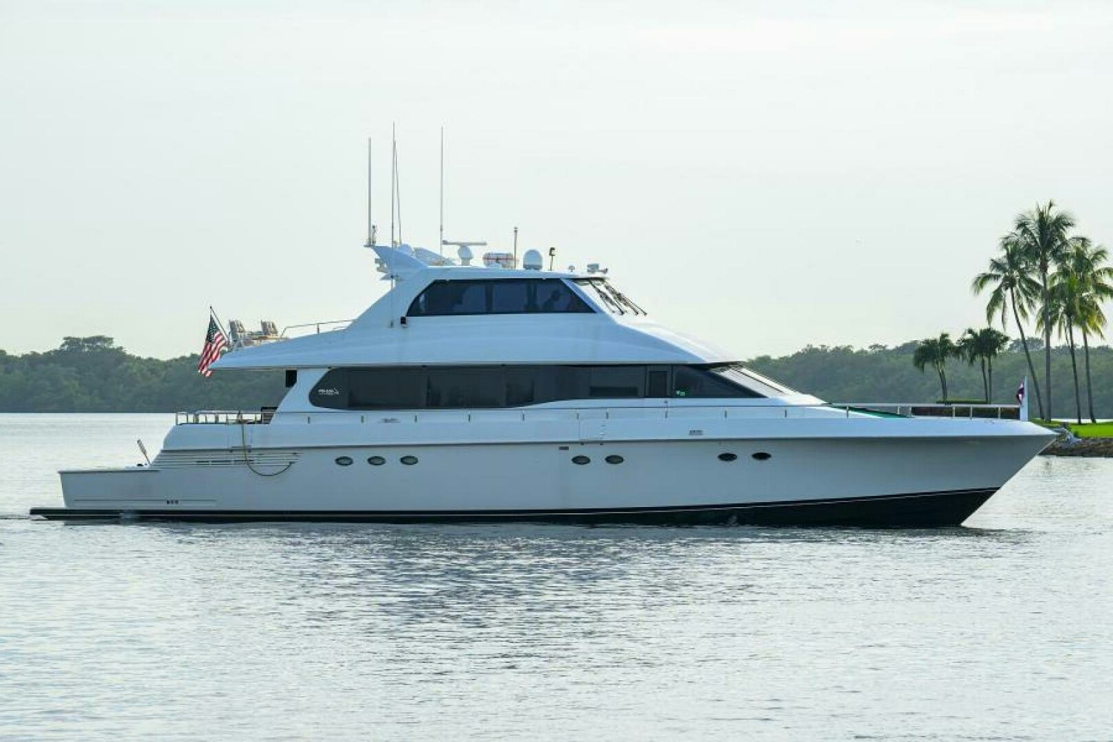 a white yacht on the water aboard 80' LAZZARA Yacht for Sale