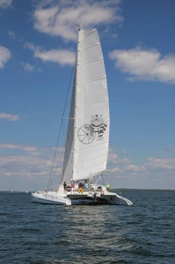 a sailboat on the water aboard FAT CAT Yacht for Sale