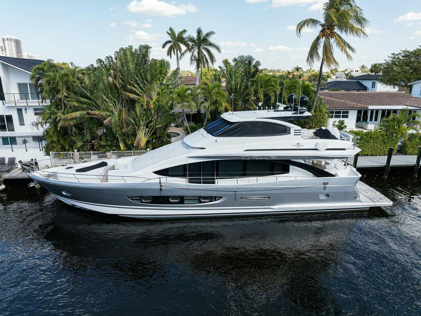 a white boat on a river aboard FUJIMO Yacht for Sale