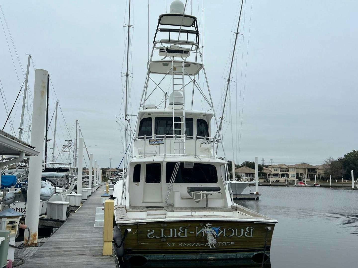 a boat docked at a pier aboard BUCK-N-BILLS Yacht for Sale