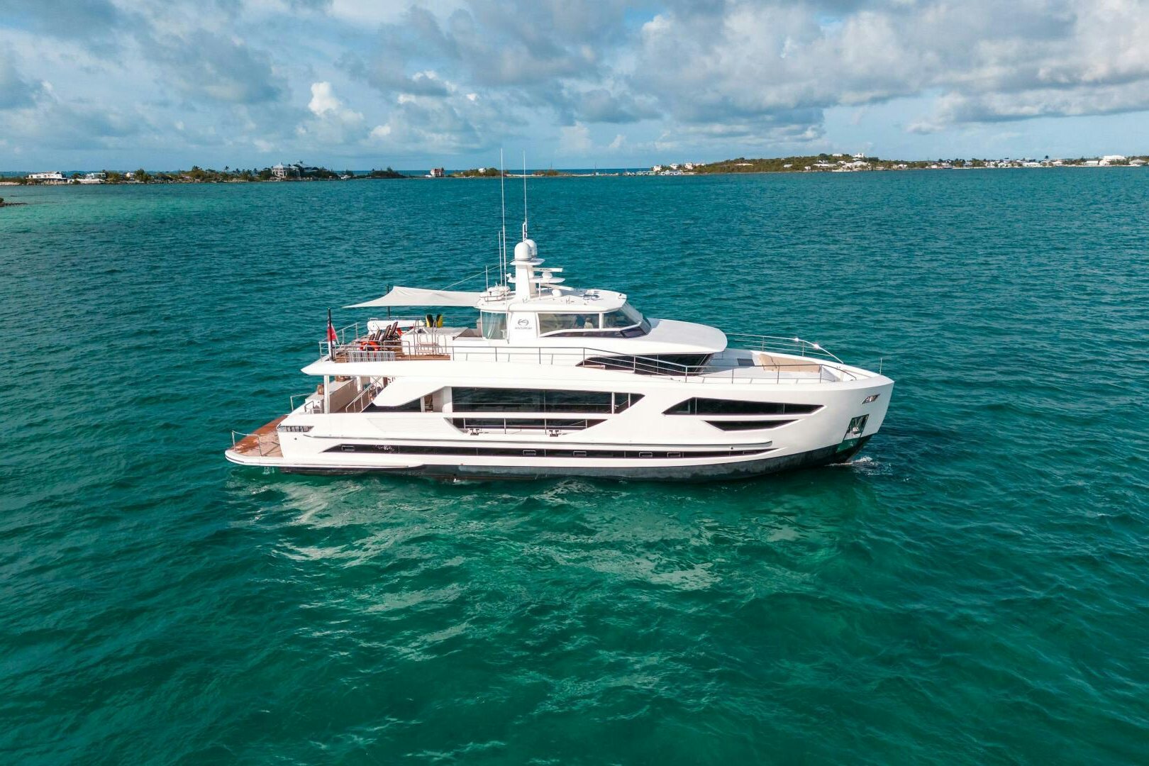 a white yacht in the water aboard MIDNIGHT MOON Yacht for Sale