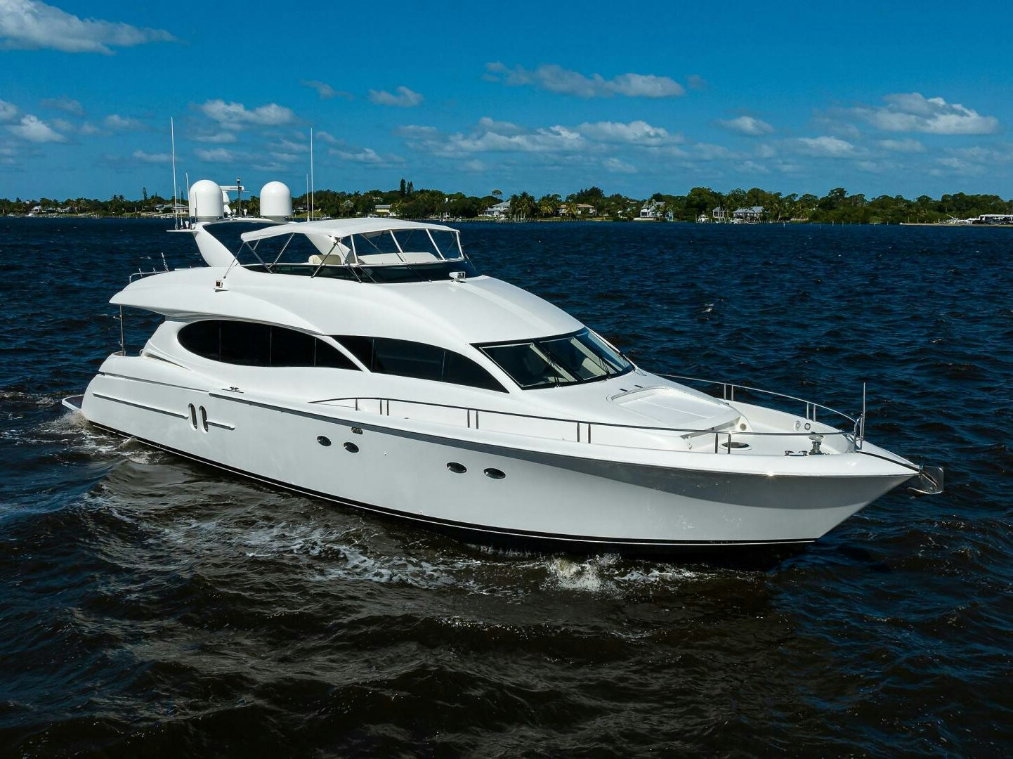 a white boat on water aboard ALWAYS BAREFOOT Yacht for Sale