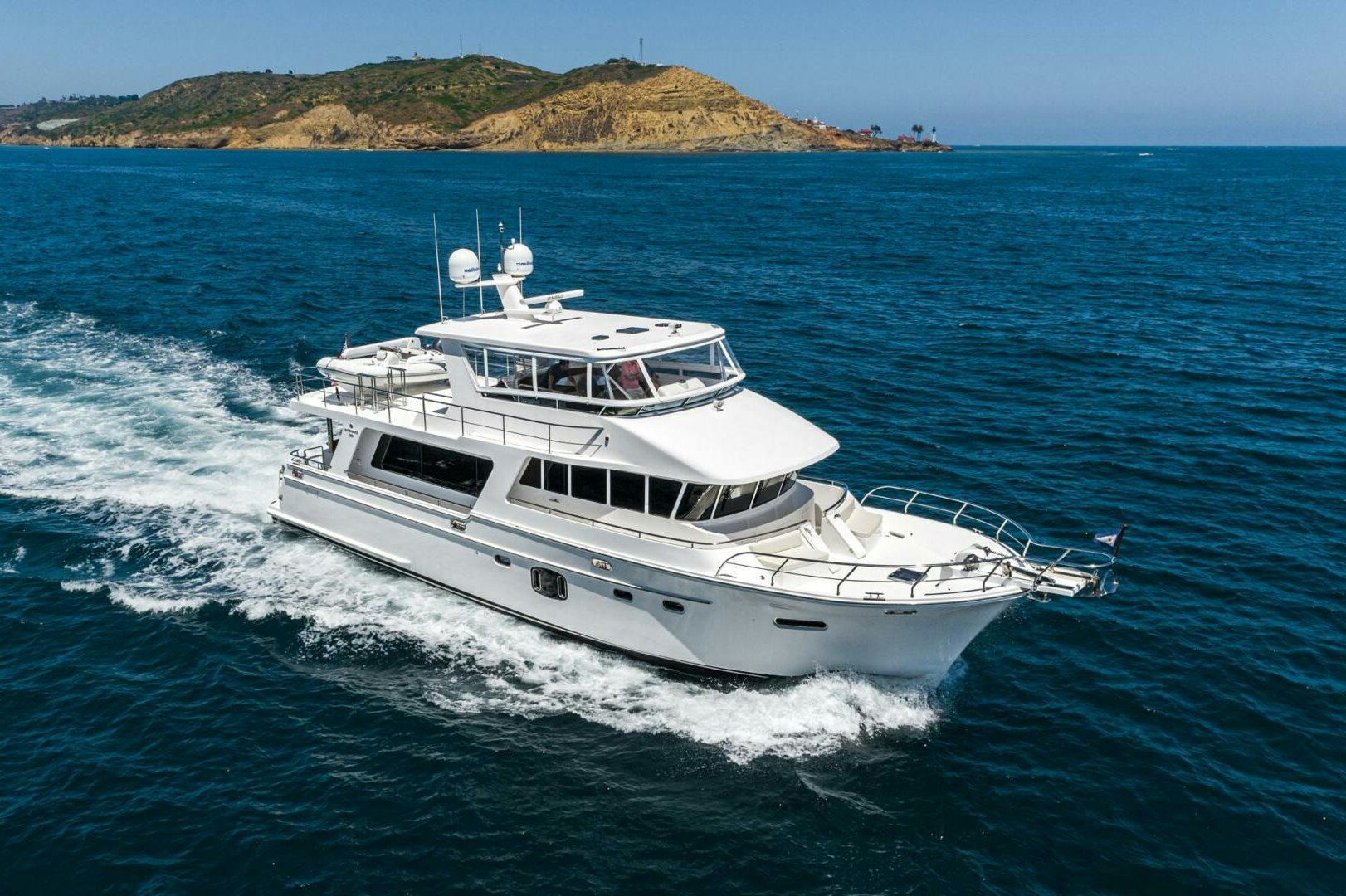 a white boat on the water aboard KING OF NOTHING Yacht for Sale