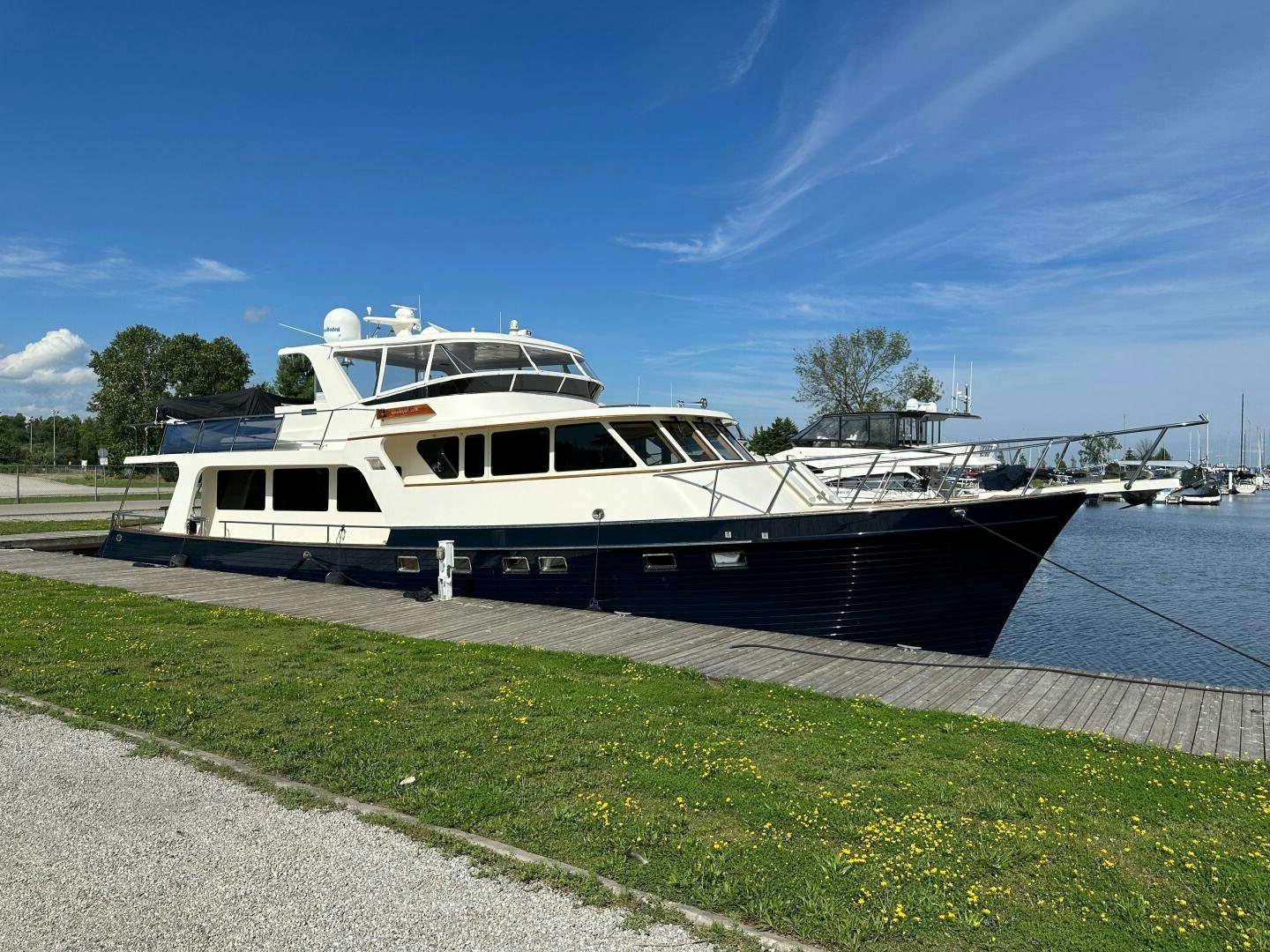 a boat parked on the side of a lake aboard MISS STEPHANIE  Yacht for Sale