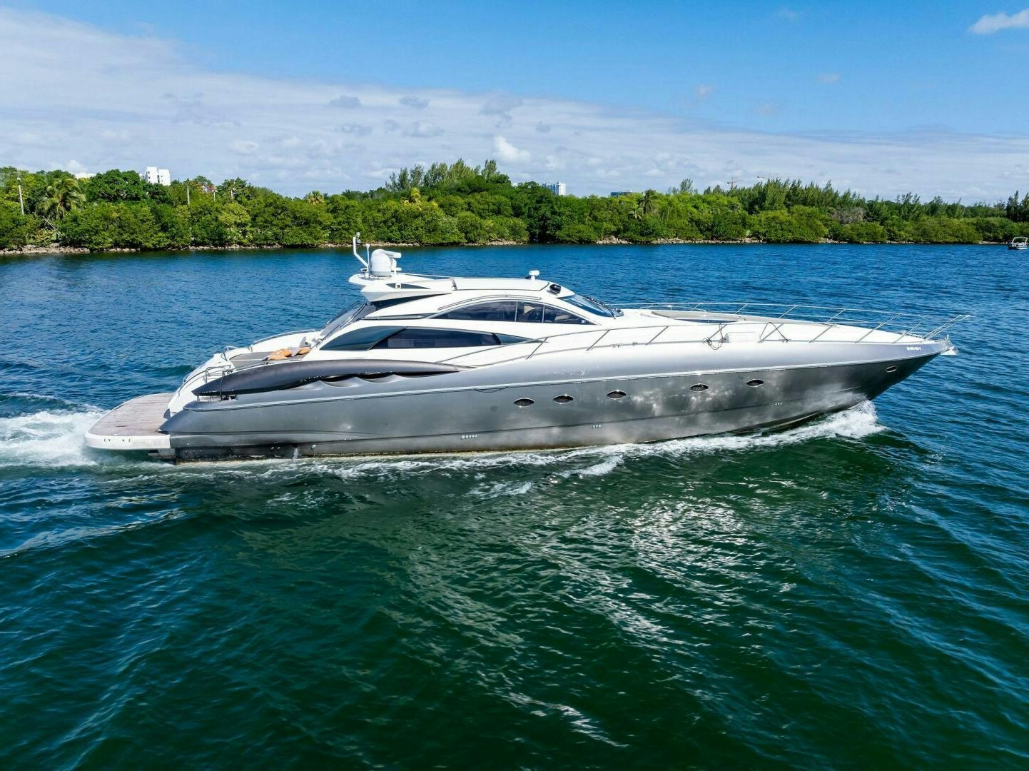 a white boat in the water aboard GAMBLER Yacht for Sale