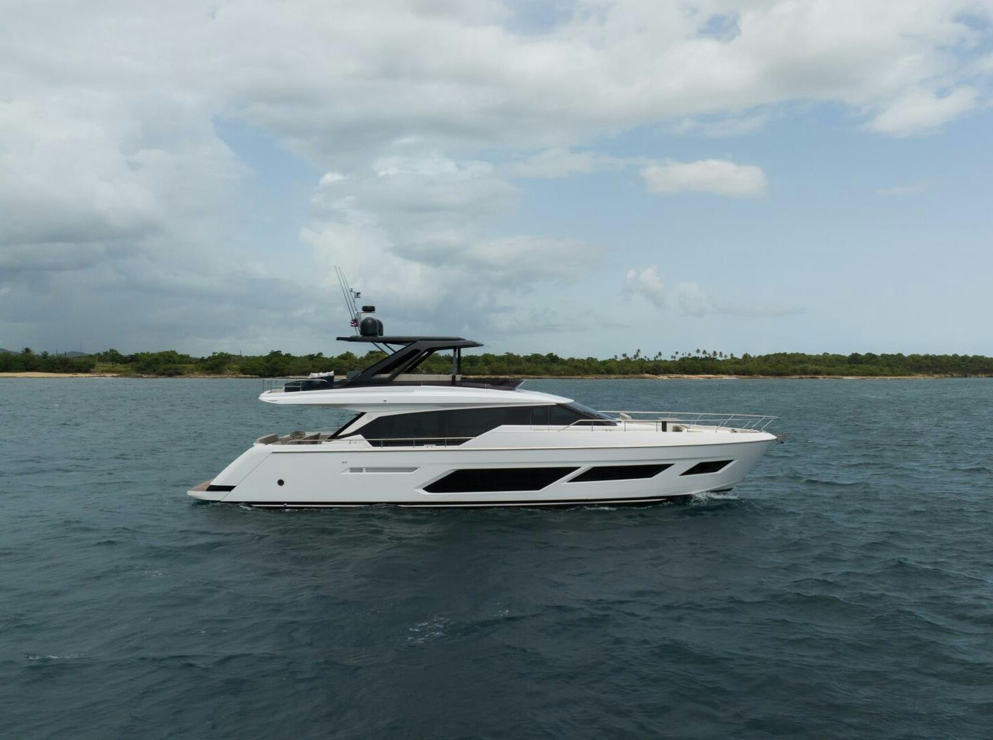 a white boat in the water aboard CALMA Yacht for Sale