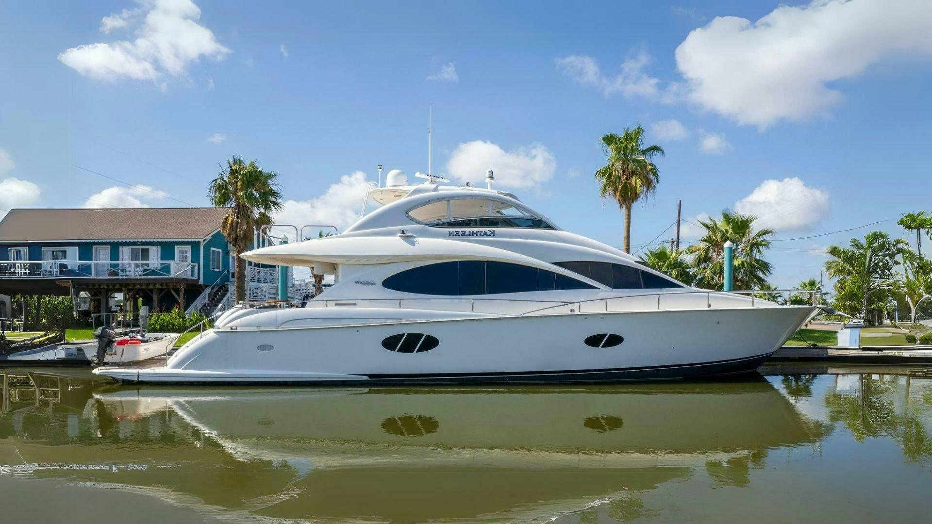 a white yacht in a tropical setting aboard KATHLEEN Yacht for Sale