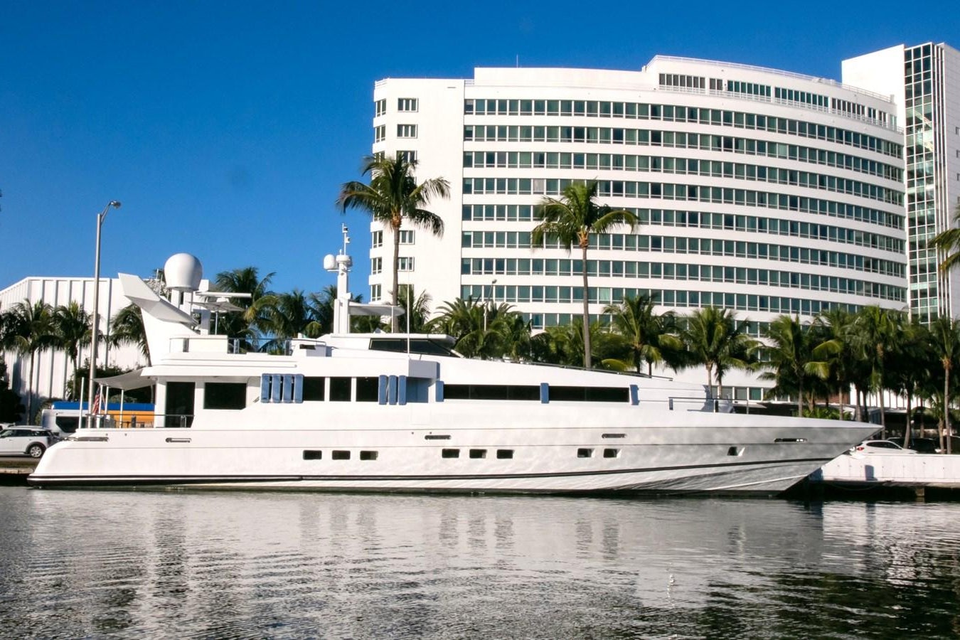 a white yacht in a harbor aboard HIGHLINE Yacht for Sale