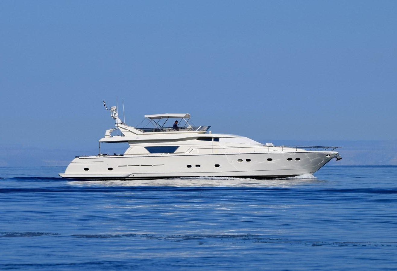 a white yacht in the water aboard SANTA MARIA III Yacht for Sale