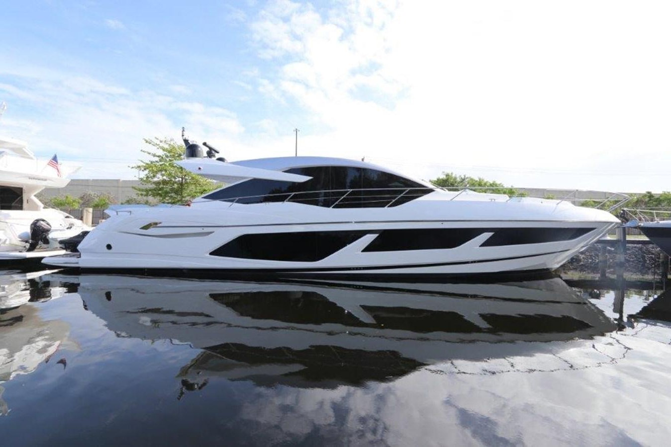 a white yacht in the water aboard HIDE OUT Yacht for Sale