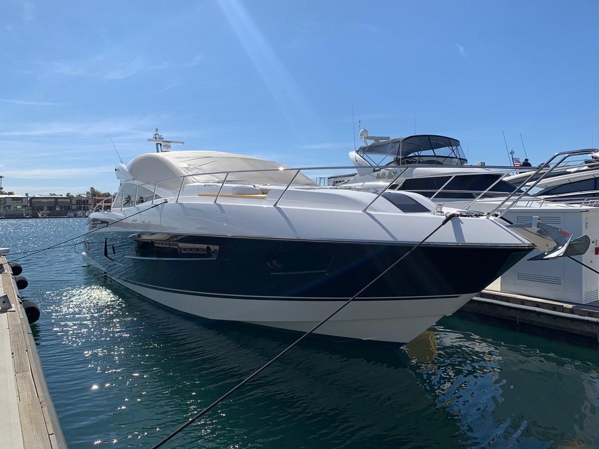 a white yacht docked aboard PIECE OF SHIP Yacht for Sale