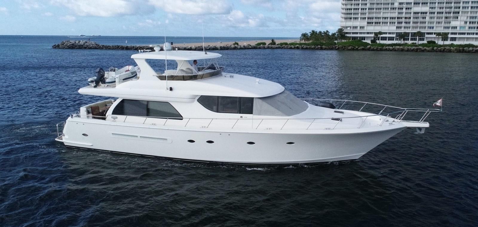 a white boat in the water aboard ROOM SERVICE Yacht for Sale