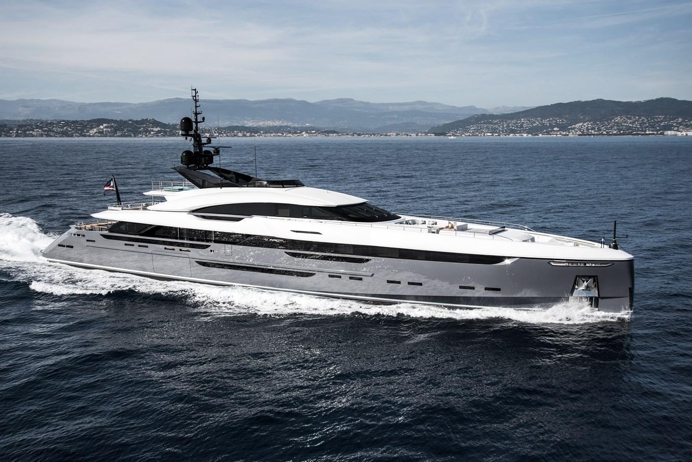 a white yacht in the water aboard UTOPIA IV Yacht for Sale
