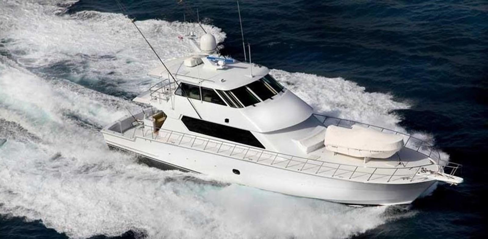 a white boat on a rough sea aboard SPHEREFISH Yacht for Sale