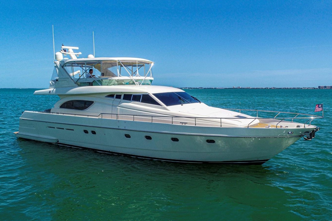a white yacht in the water aboard FERRETTI Yacht for Sale