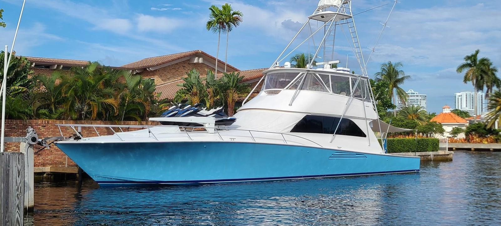 a white boat in the water aboard CURIOUS GEORGE Yacht for Sale