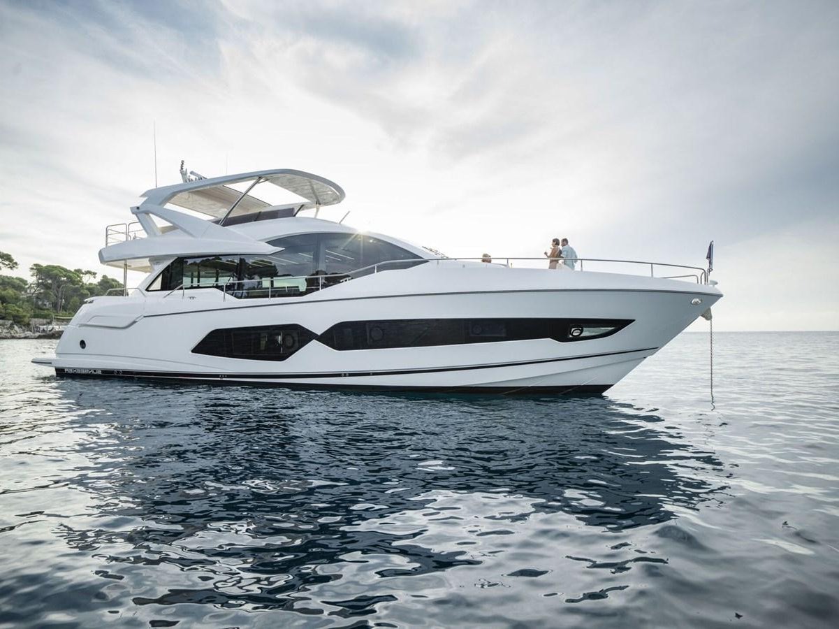 a white yacht on the water aboard SUNSEEKER 76 YACHT Yacht for Sale