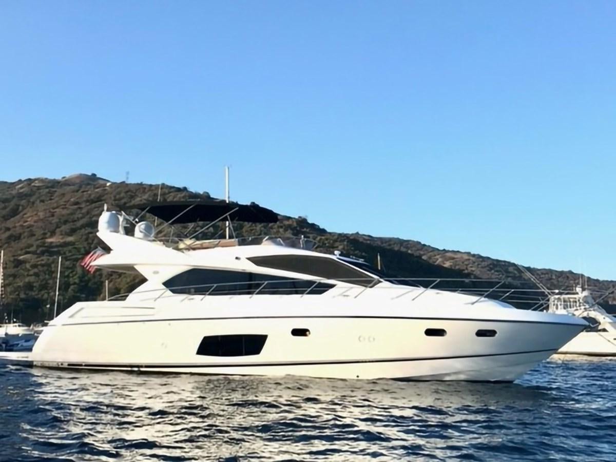 a white yacht on a body of water aboard MOONLIGHT DRIVE Yacht for Sale