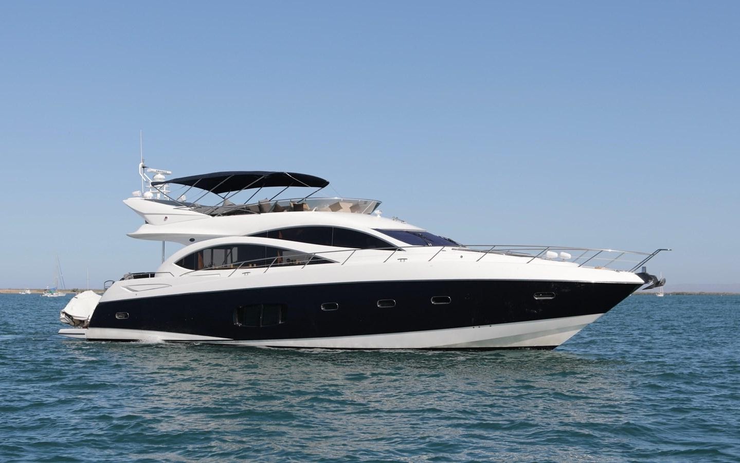 a white yacht on the water aboard CAPRICHO II Yacht for Sale