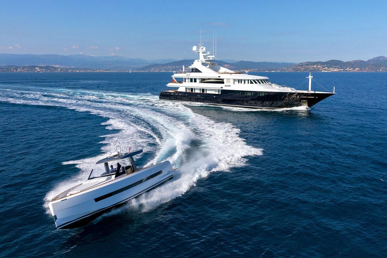 a couple of boats on the water aboard TREEHOUSE Yacht for Sale