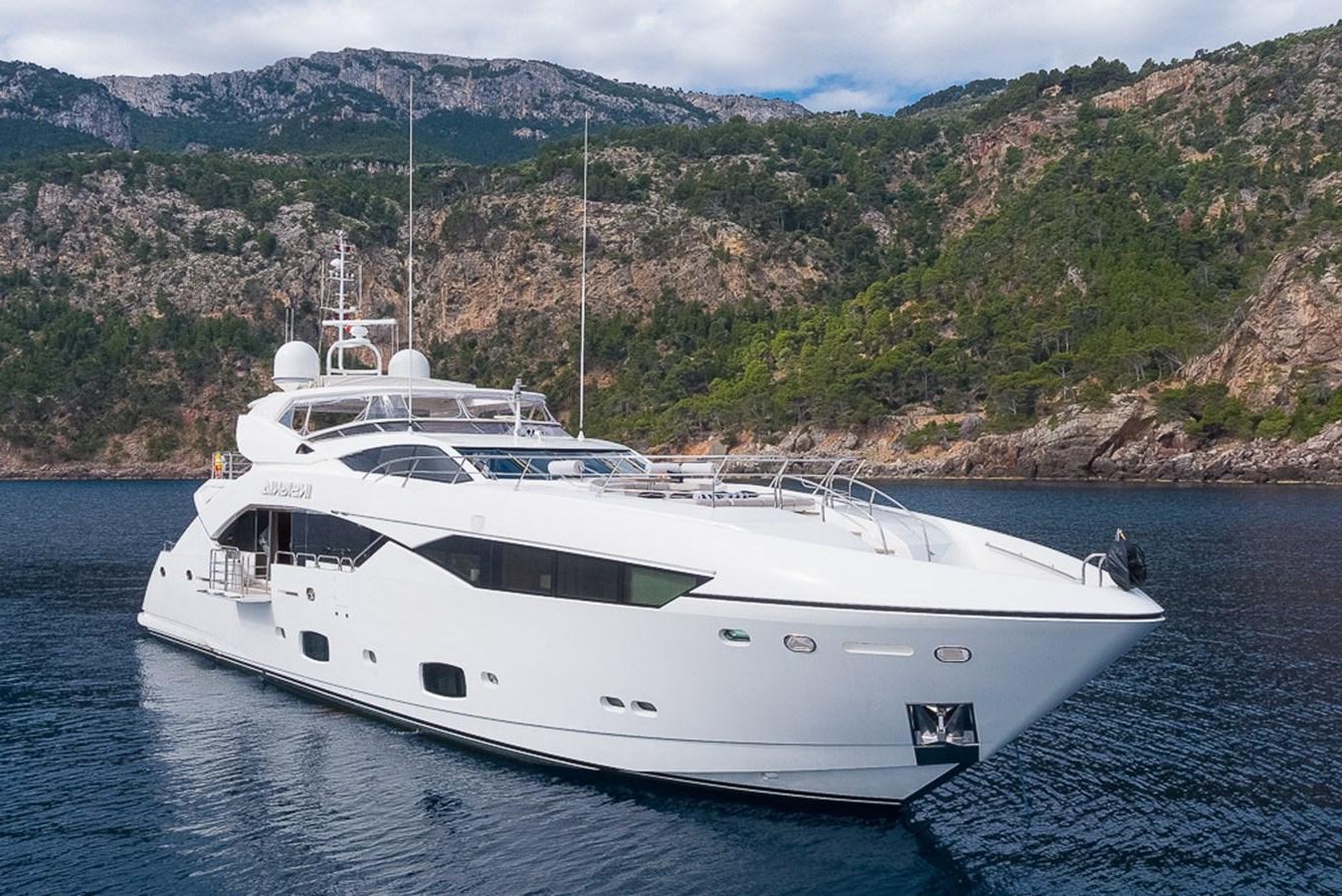 a white yacht in the water aboard INSIGNIA Yacht for Sale