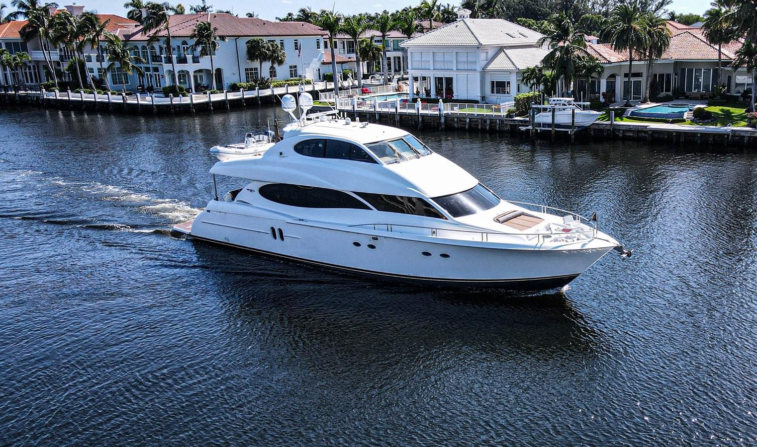 a white boat on water aboard NEW HORIZON Yacht for Sale