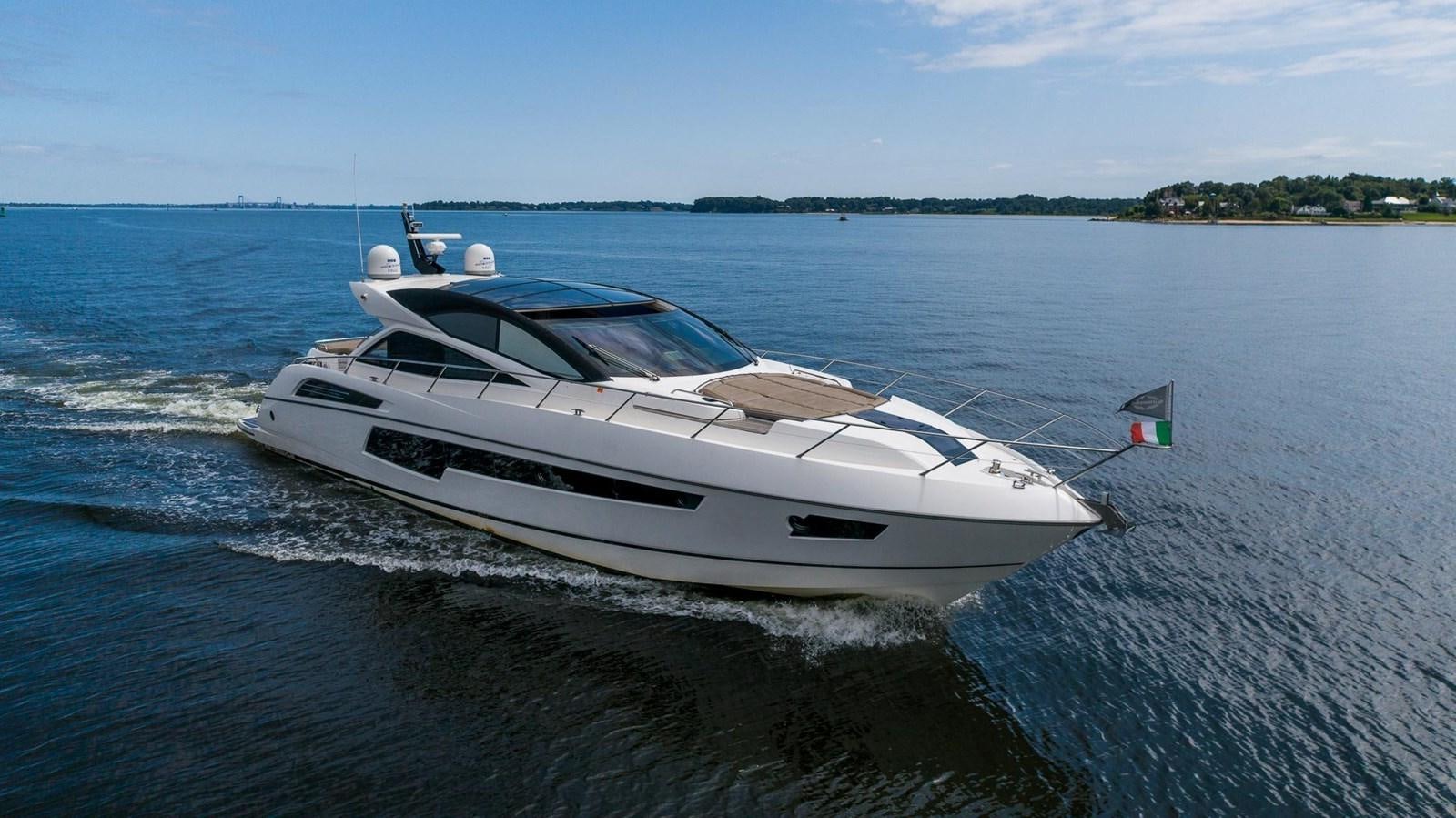 a white boat on the water aboard YOLO Yacht for Sale