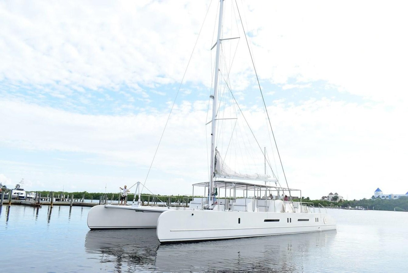 a white boat on the water aboard SEA COMPASS 82 Yacht for Sale
