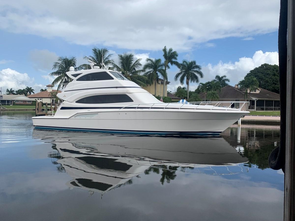 a white boat in a body of water aboard REEL BUSY Yacht for Sale