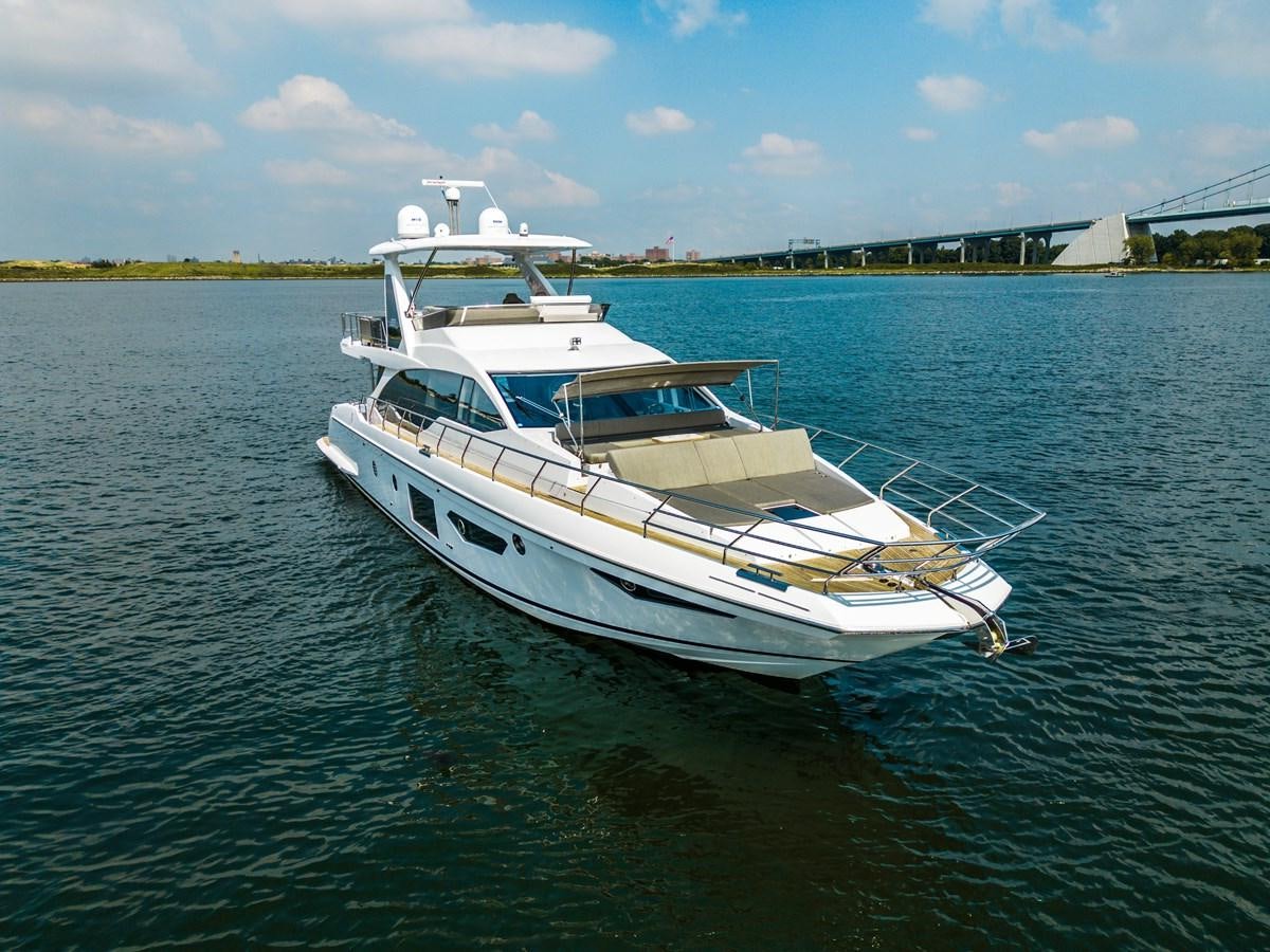 a white boat in the water aboard EVADO Yacht for Sale