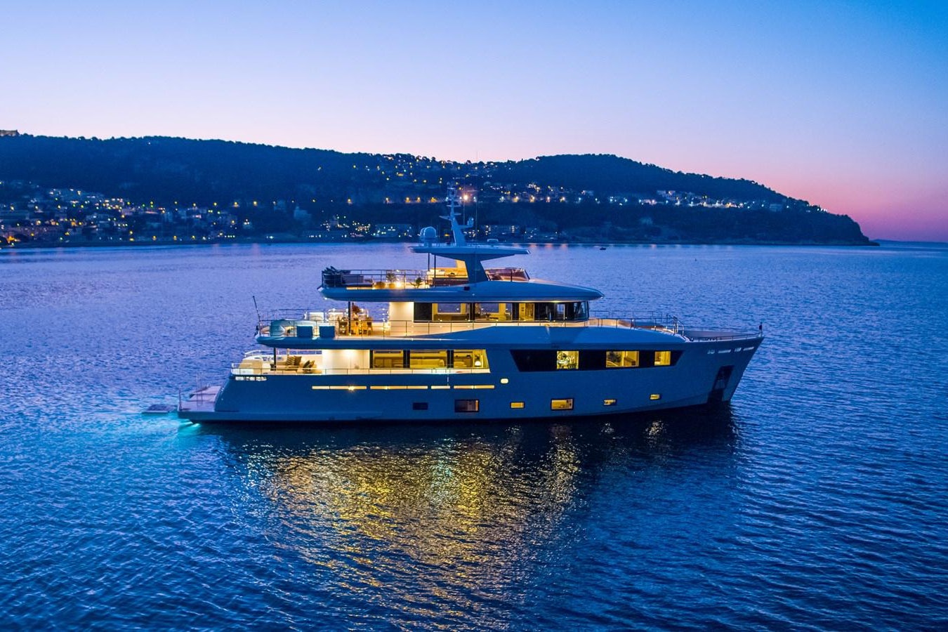 a large yellow boat on the water aboard SABAI Yacht for Sale