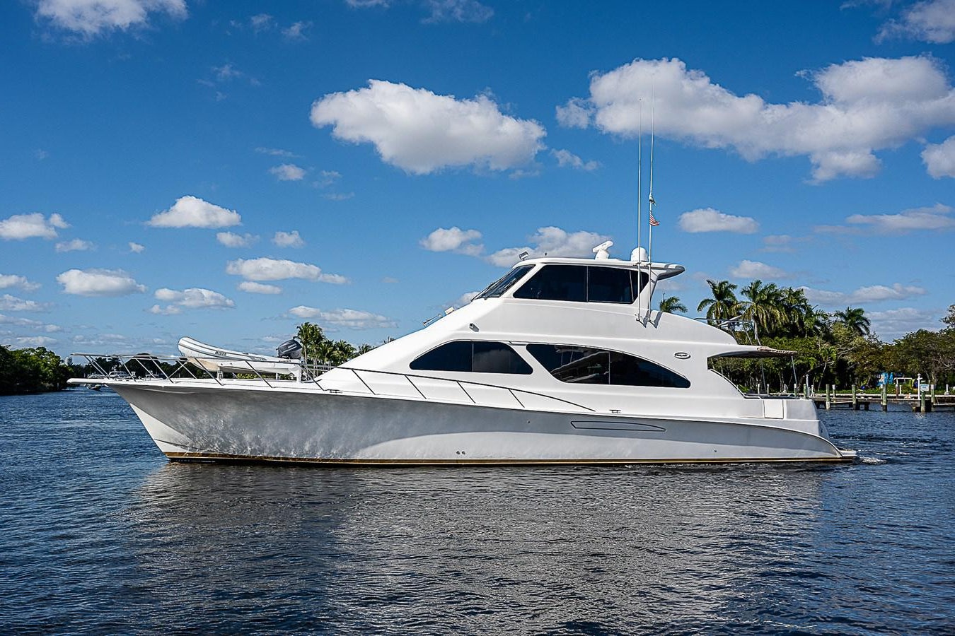 a white yacht on the water aboard THIS LITTLE PIGGY Yacht for Sale