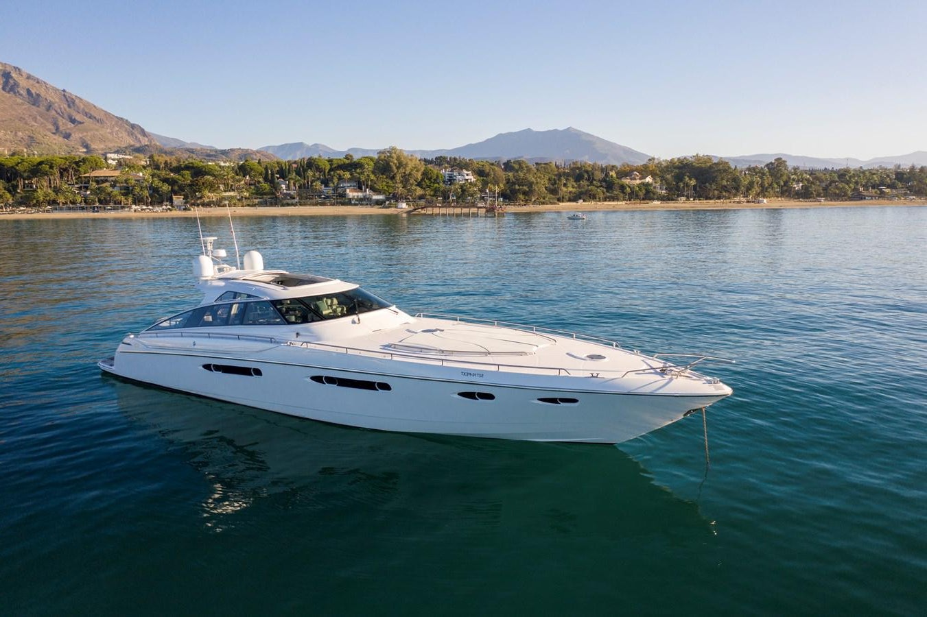 a white yacht in the water aboard 4F Yacht for Sale