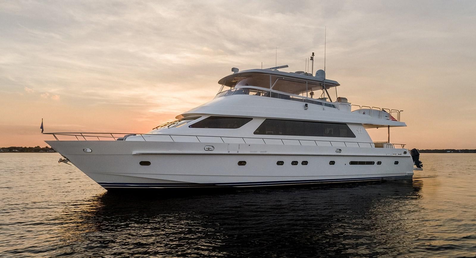 a white yacht on the water aboard DARK HORSE Yacht for Sale