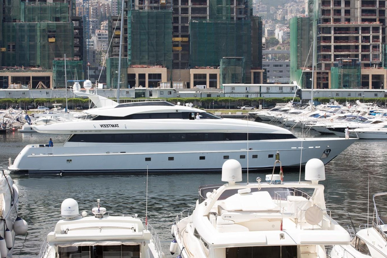 a yacht in a harbor aboard TAMTEEN Yacht for Sale