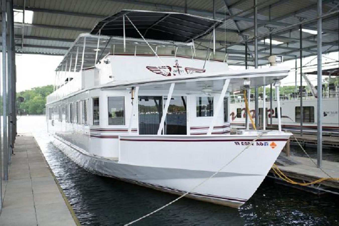 a white and red boat aboard 88 LAZY DAYS BEACHEM Yacht for Sale