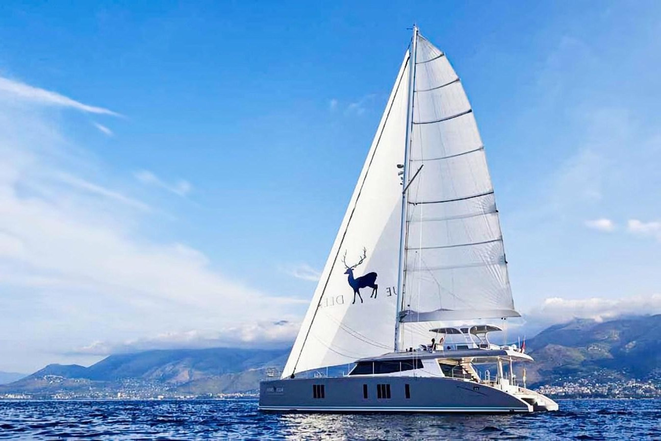 a person on a sailboat aboard BLUE DEER Yacht for Sale
