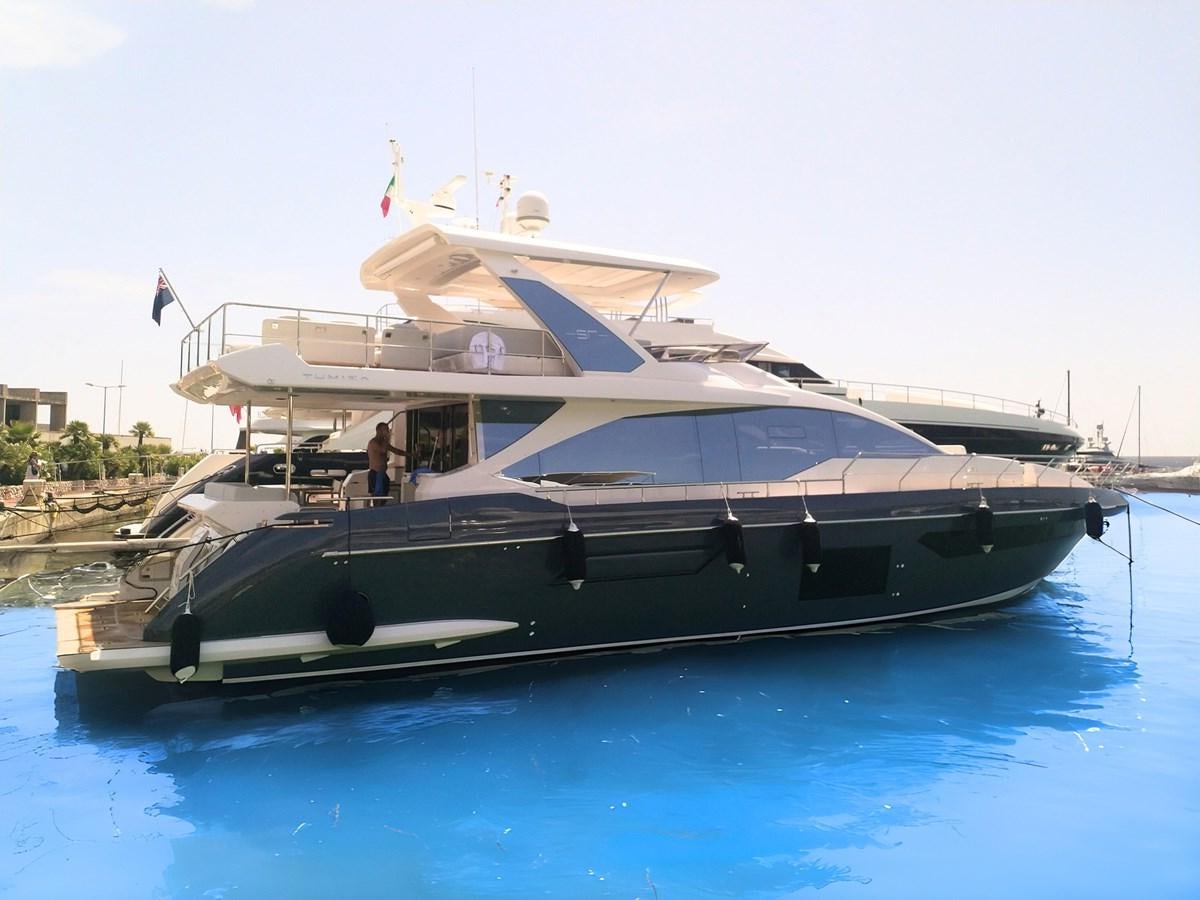 a boat docked at a pier aboard BLUE Yacht for Sale