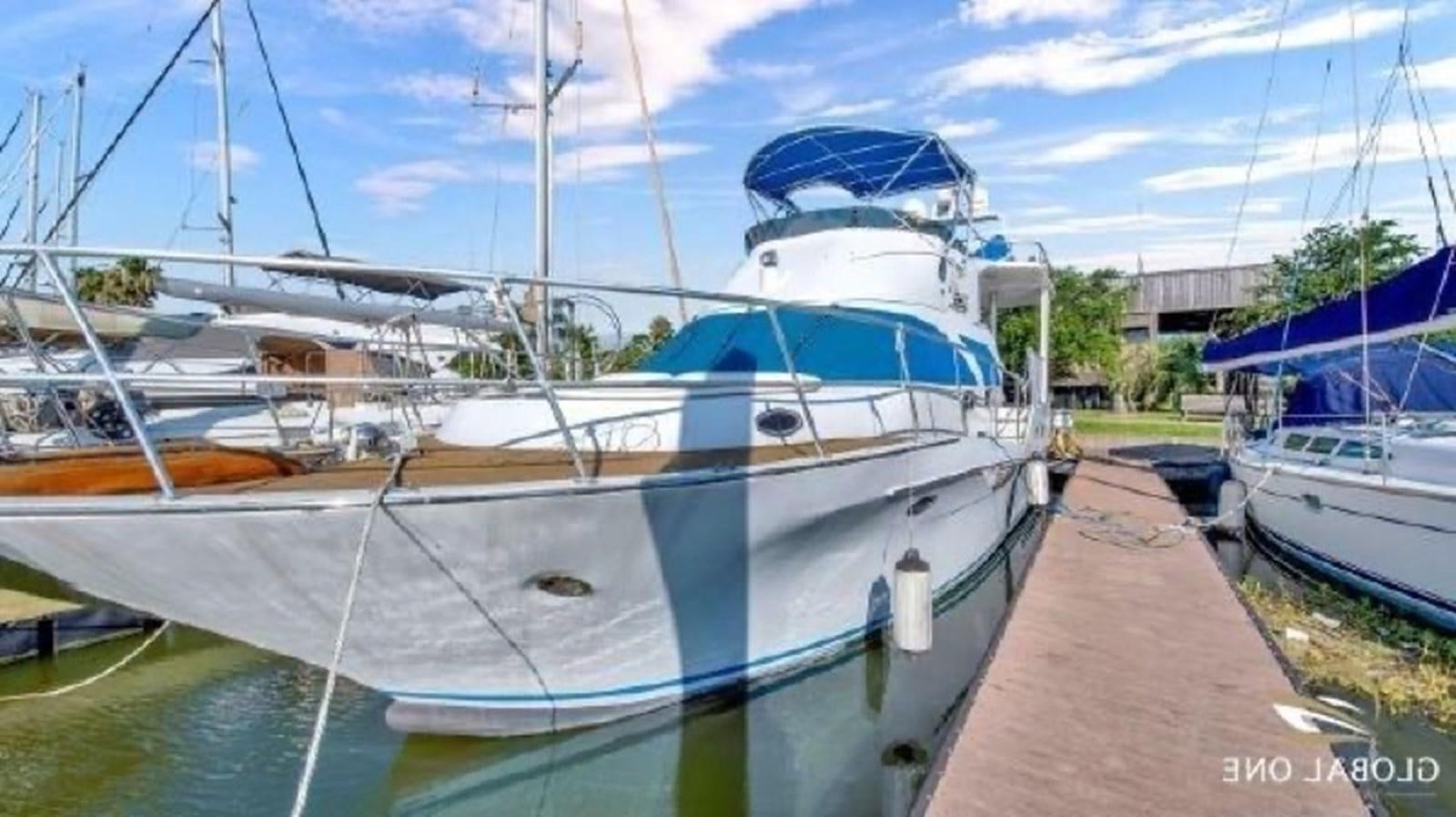 a boat docked at a pier aboard DREAM CATCHER Yacht for Sale