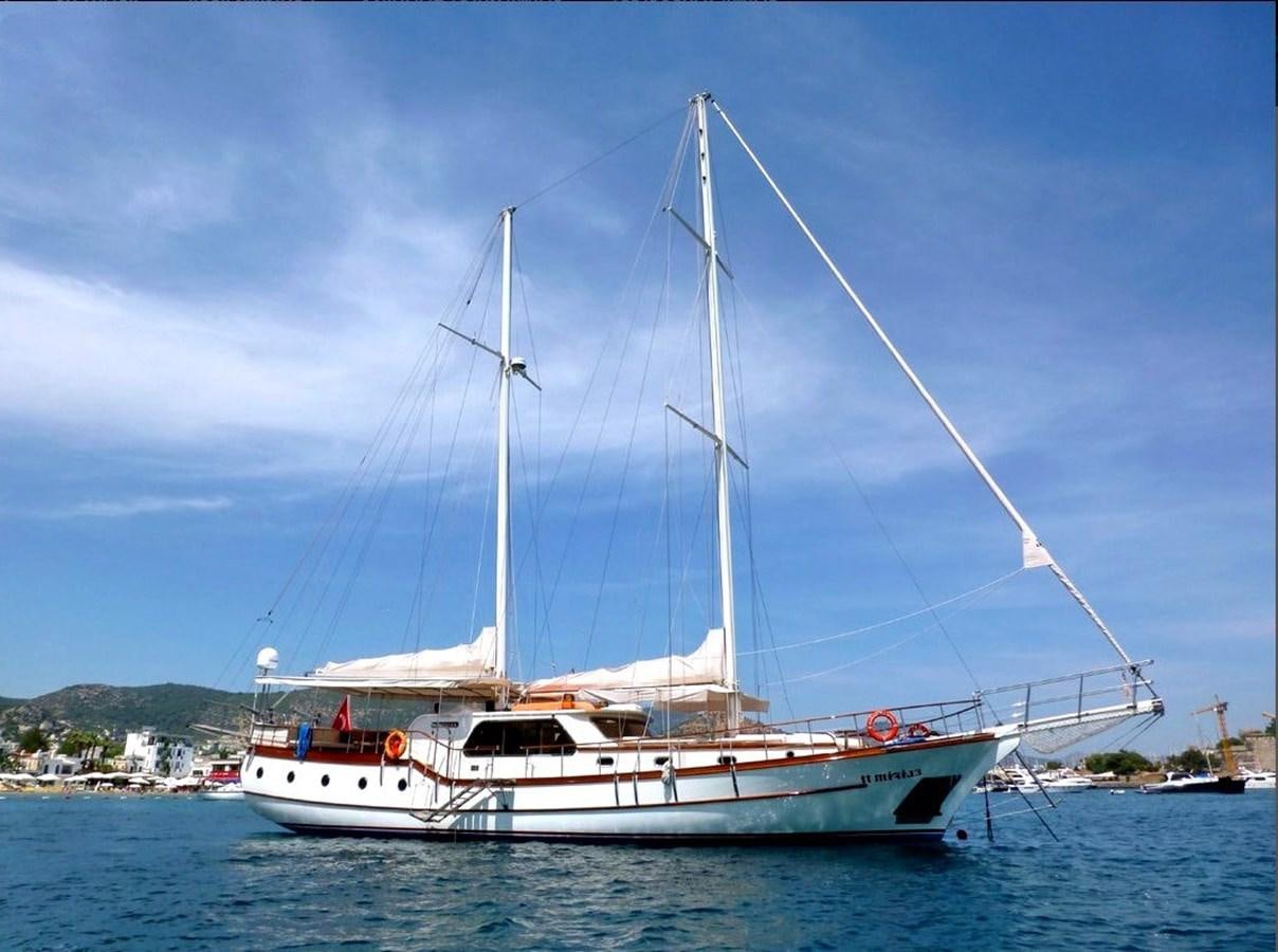 a white boat on the water aboard ELIFIM 11 Yacht for Sale