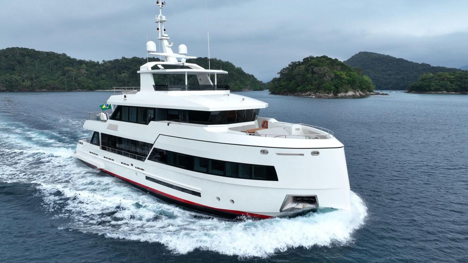 a white boat on the water aboard WAIKIKI Yacht for Sale