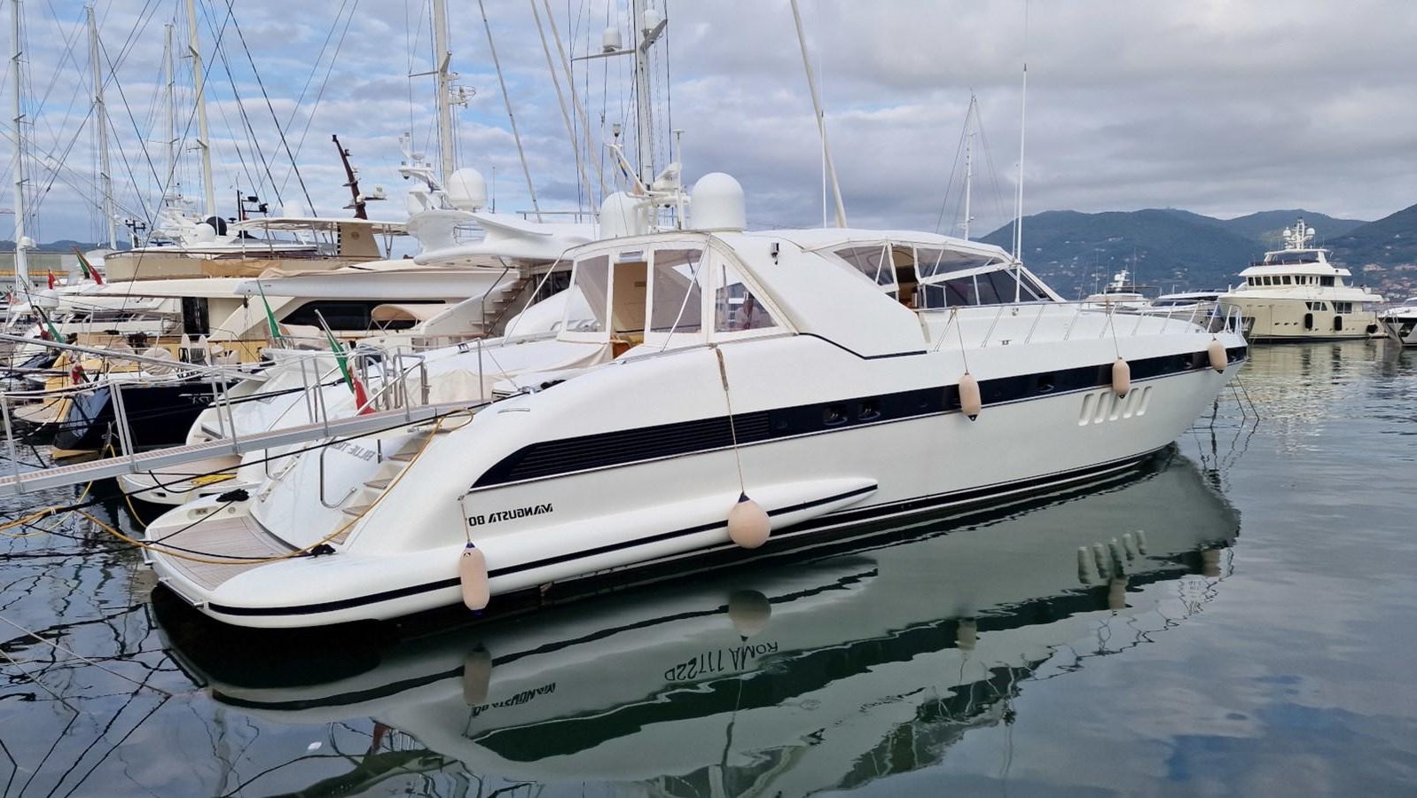 a group of boats in a harbor aboard BLUE TRINITY Yacht for Sale