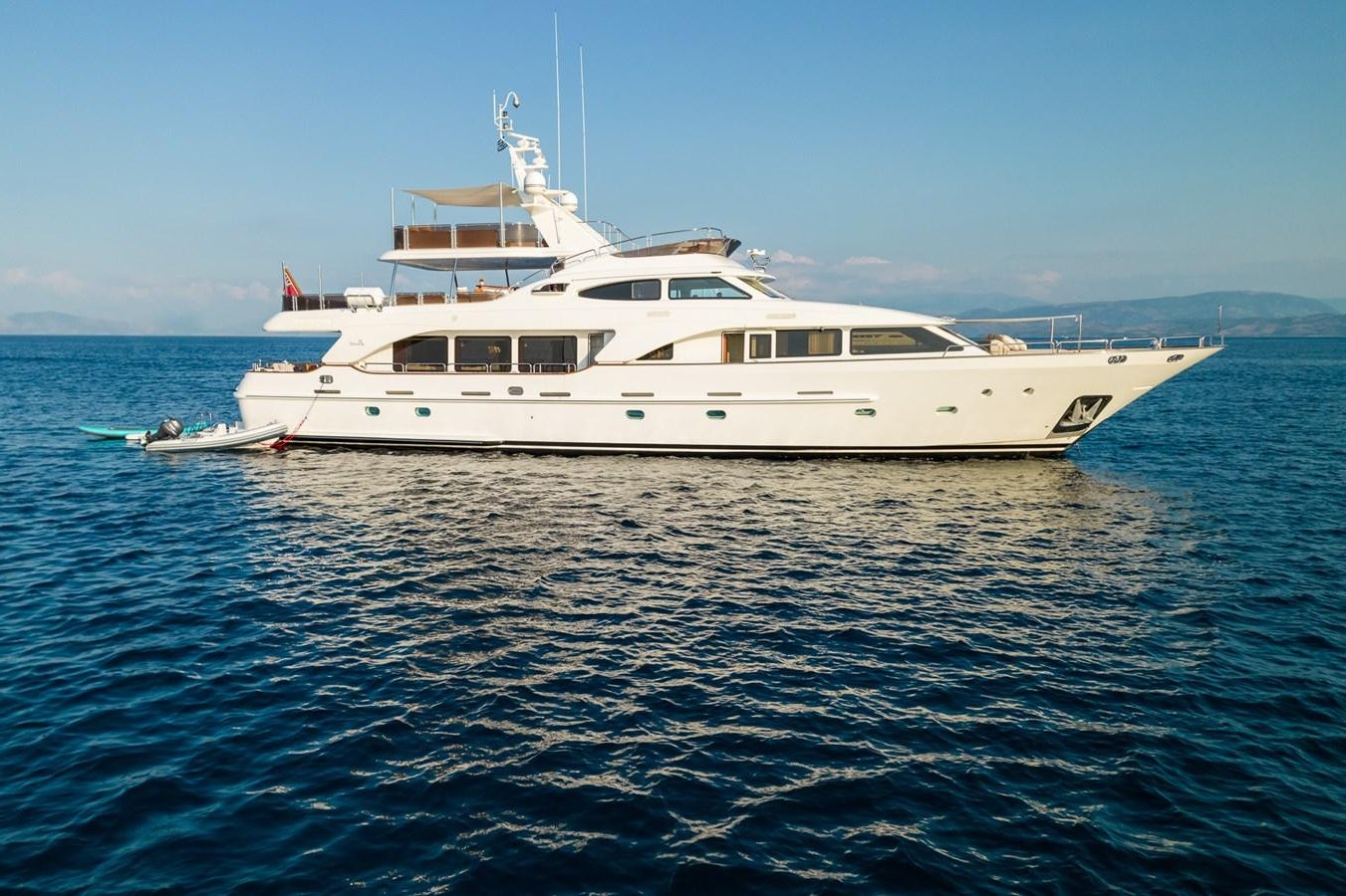 a white boat in the water aboard ENDLESS SUMMER Yacht for Sale