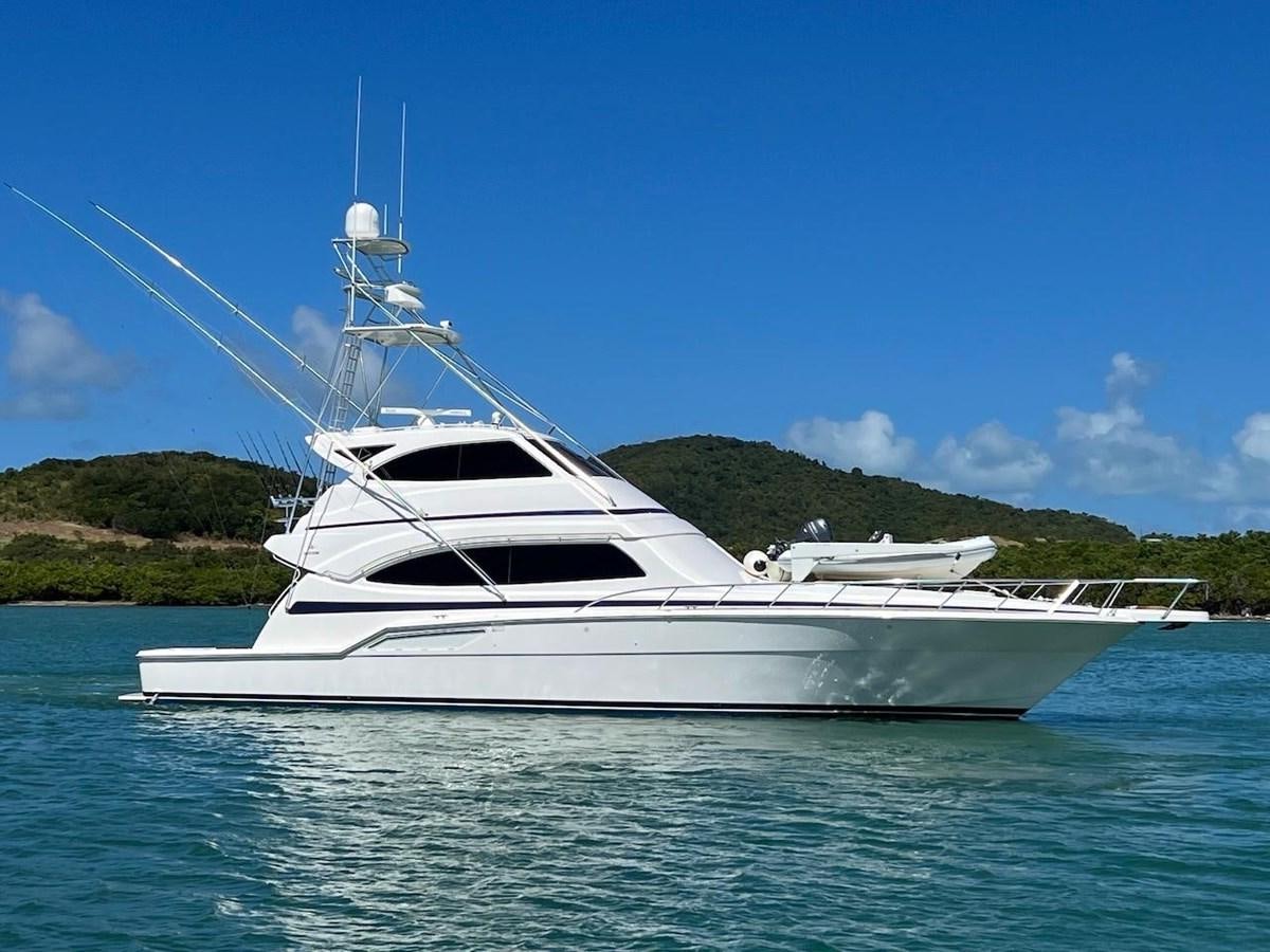 a white yacht on the water aboard BEACH BUM Yacht for Sale