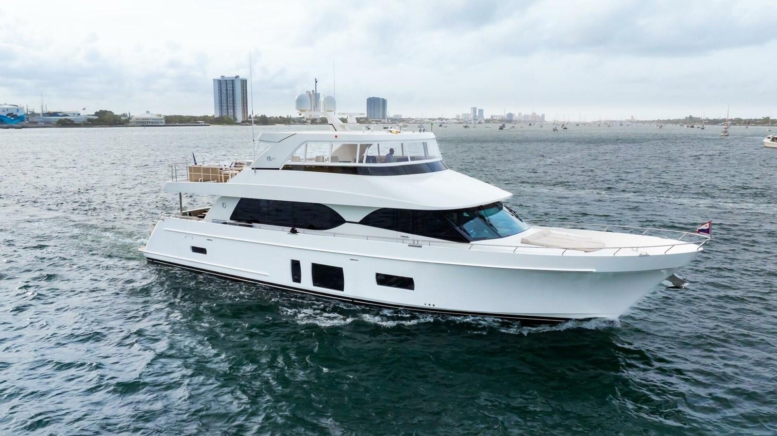 a white yacht in the water aboard CRUMDALE Yacht for Sale