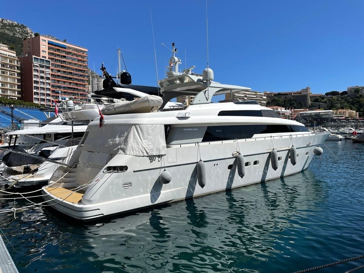 a white yacht in a harbor aboard KAVALIER Yacht for Sale