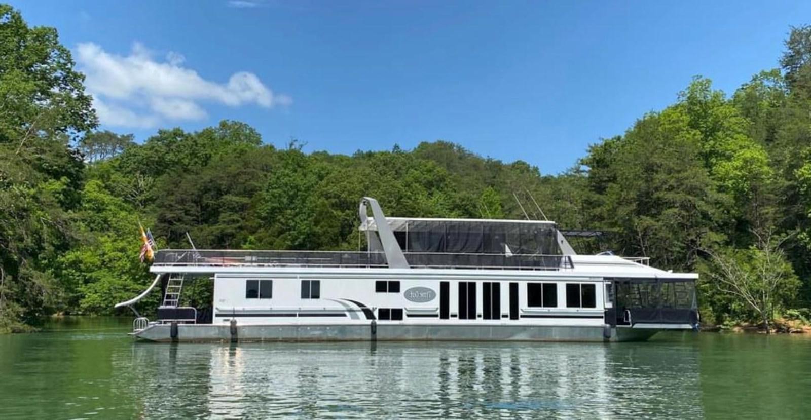 a boat on the water aboard 2005 HORIZON 18X88 HOUSEBOAT Yacht for Sale