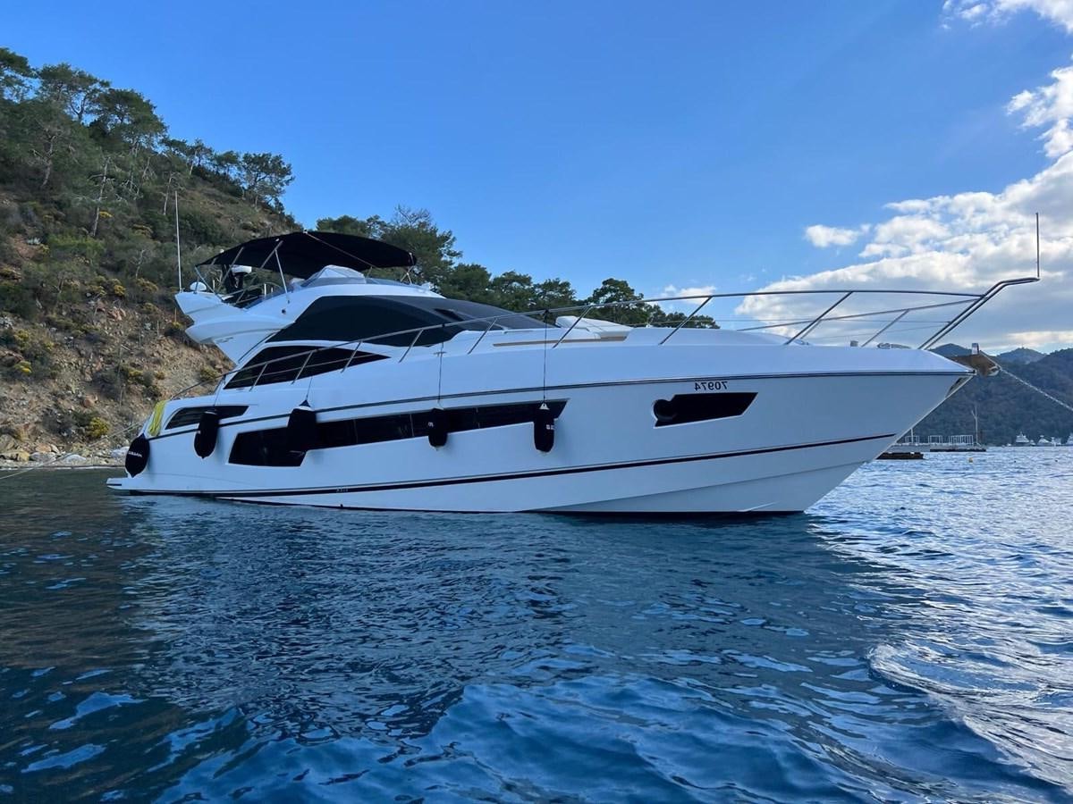 a white yacht on the water aboard SUNSEEKER 75 YACHT Yacht for Sale